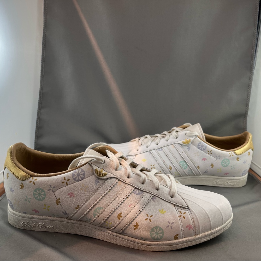 Womens Adidas Sleek Series sneakers with gold and pastel accents.US 7.5